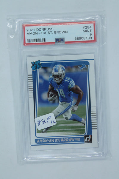 Amon-Ra St. Brown 2021 Panini Donruss Rated Rookie Rookie Card - PSA MINT 9